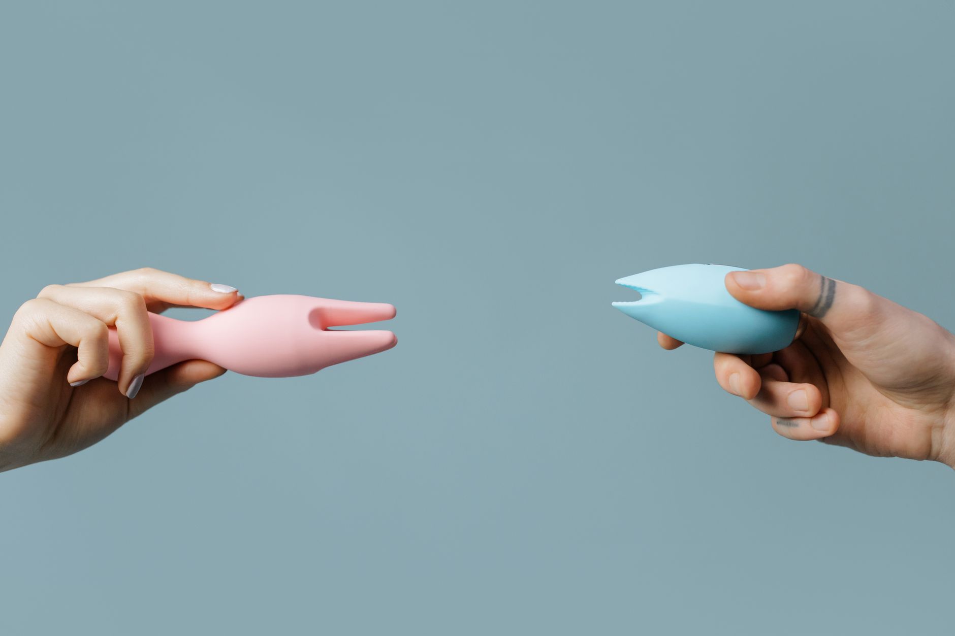 Hand holding a fresh lemon against a vibrant yellow background, symbolizing fresh perspectives on sexual wellness and desire.
